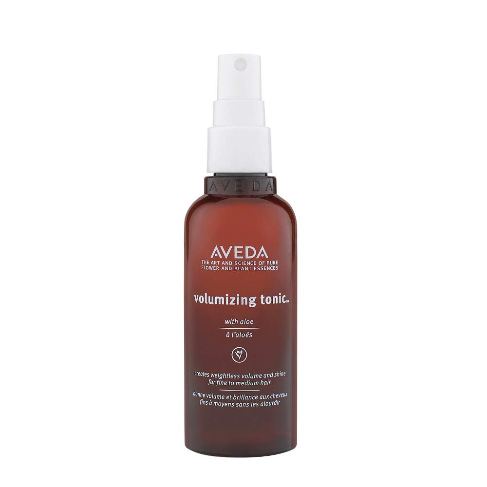 Aveda volumizing tonic bottle on a white background