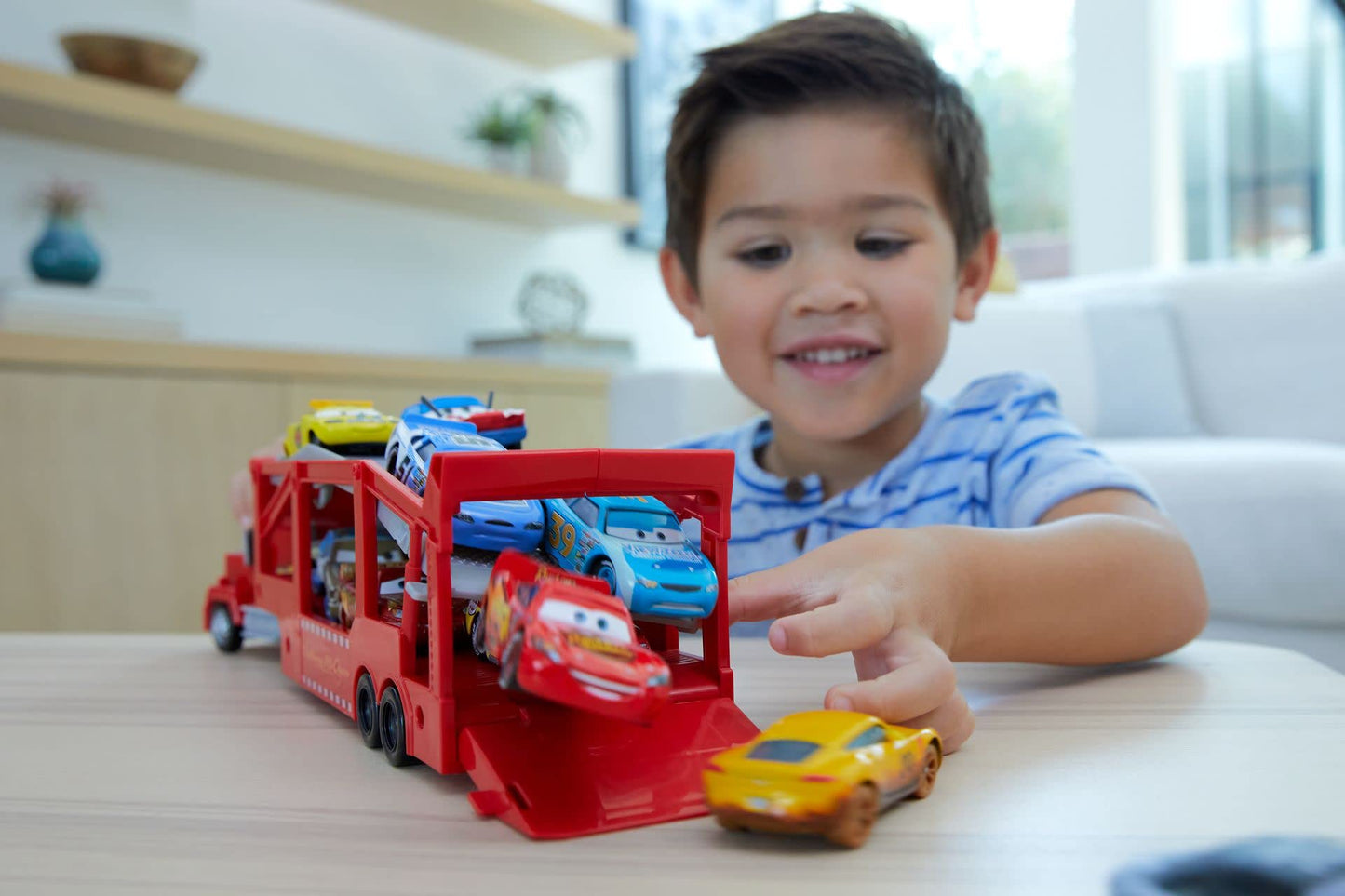 Mattel Disney and Pixar Cars Mack Hauler, 13-inch Toy Transporter Truck with Ramp & Carry Storage for 12 Vehicles, Gift for Kids Ages 4 Years Old & Up
